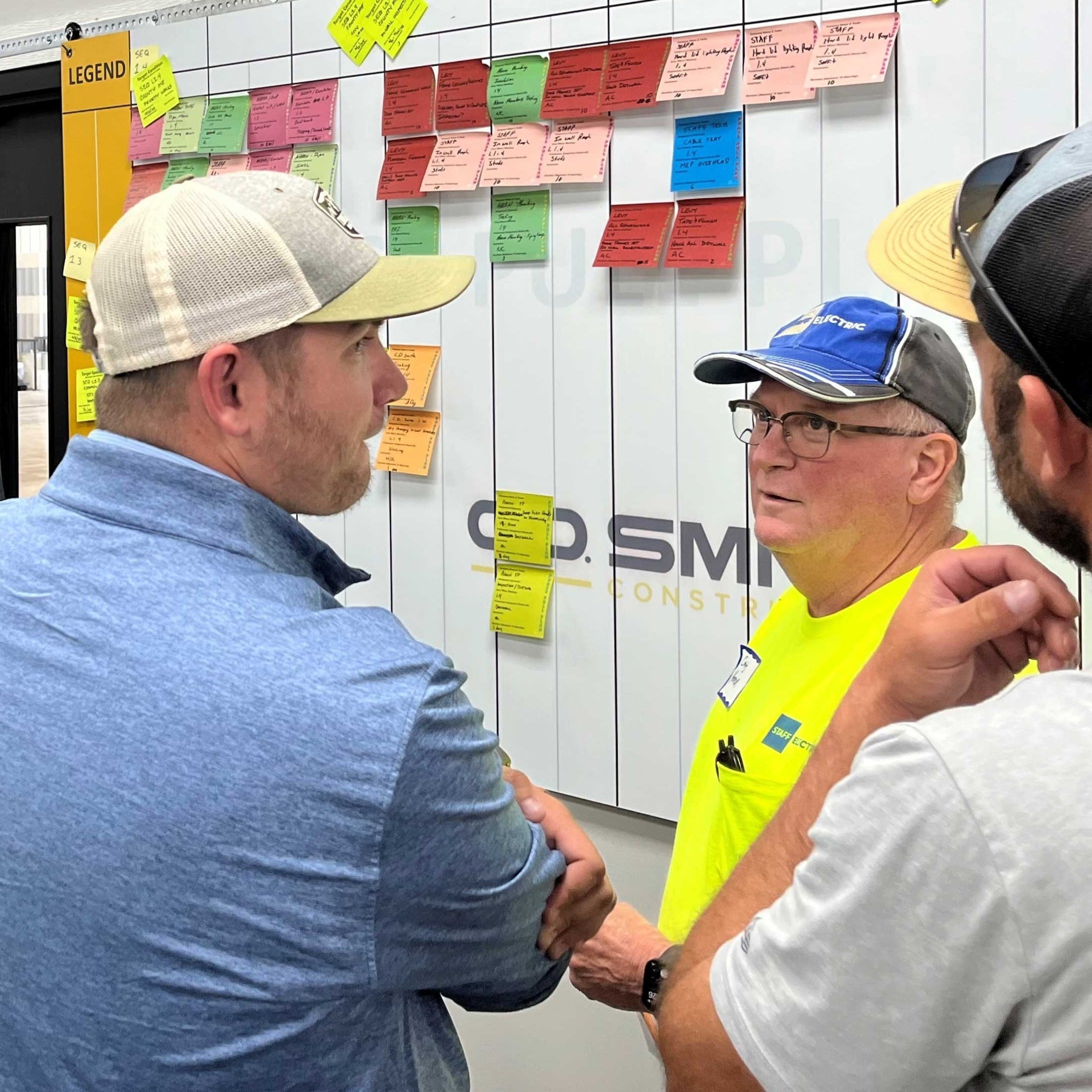 CD Smith Construction Project Group using LEAN Pull Planning approach with Post-Its on whiteboard